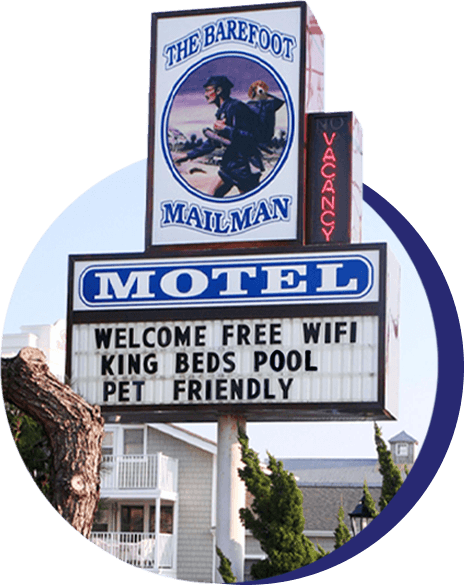 Motel sign at the Barefoot Mailman welcoming guests and pets.